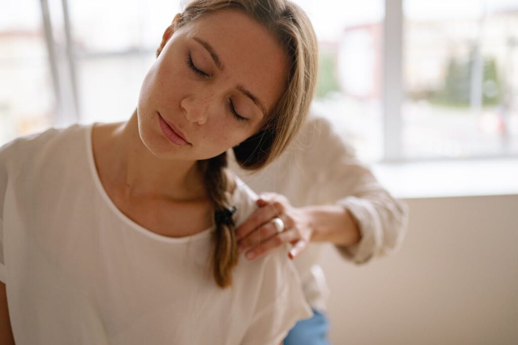 A Woman with Her Eyes Closed Having a Massage