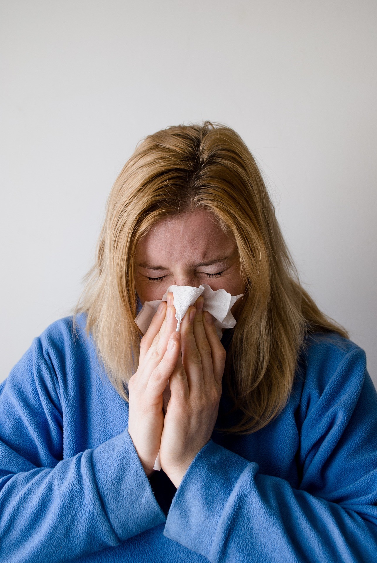 woman blowing nose.jpg